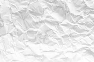 white and gray crumpled paper texture background. crush paper so that it becomes creased and wrinkled. photo