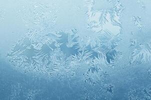 Abstract frosty pattern on glass, background texture photo