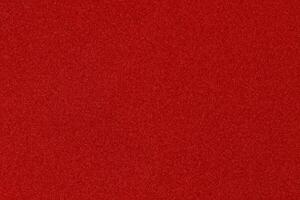 red Christmas background with shiny color speckles photo