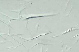 A sheet of white crumpled paper. Abstract background for design. photo