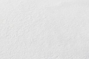 uniforme nieve cubrir. nieve textura en un plano trama de tierra foto