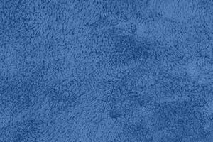 Blue sherpa textured plush fabric material background photo