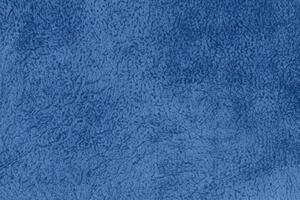 Blue sherpa textured plush fabric material background photo