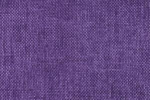 Jacquard woven upholstery, purple coarse fabric texture close up photo