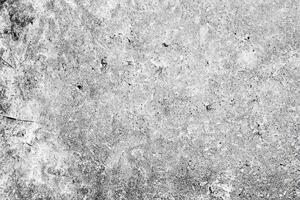 Texture of a concrete wall with cracks and scratches which can be used as a background photo