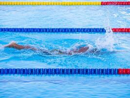 Young man swimmer in the competition. Concept of sport. Space for text photo