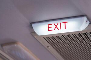 Close-up of exit sign safety on the bus with space for text photo