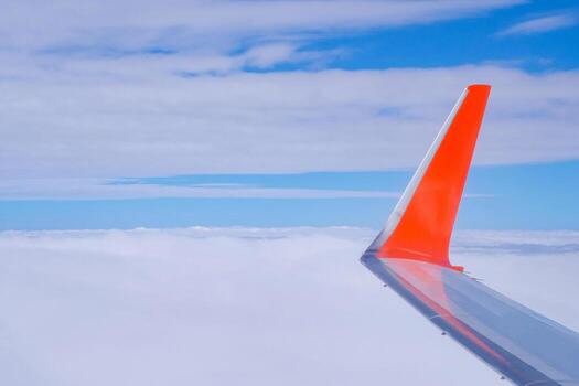 High angle view of clouds over the landscape against the sky is seen through the airplane window. Feeling freedom and new inspiration. Skyline background with copy space. photo