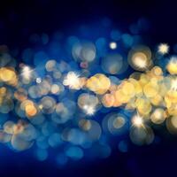 Blue and gold Christmas background with bokeh lights and stars photo