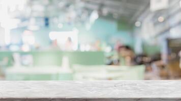 Empty white marble stone table top and blur glass window interior restaurant banner mock up abstract background - can used for display or montage your products. photo