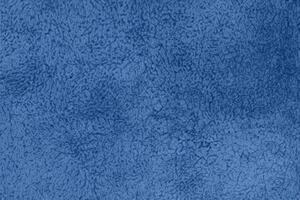 Blue sherpa textured plush fabric material background photo
