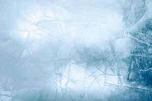 Cracked blue ice texture background photo