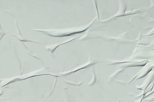 A sheet of white crumpled paper. Abstract background for design. photo