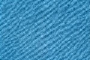 Blue velveteen upholstery fabric texture background. photo
