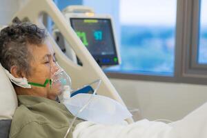 Close up of elderly woman patients with lung disease, getting oxygen for treatment in the room at hospital. Space for text. Health care concept photo