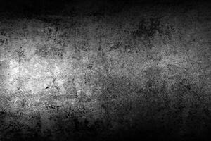 Black textured stone wall background photo