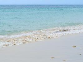 Beautiful soft white bubble of sea wave on the beach at Phuket, Thailand photo