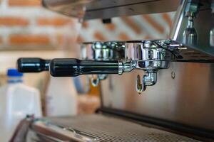 Close-up of coffee machine ready to make espresso by barista photo