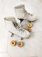 old-fashioned roller skates with removed wheels photo