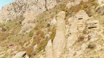 Flying aerial view on Beautiful and huge mountain rock at sunset. Shot. Stones and rocks on mountain background with sunlight video