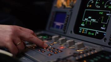 Panel of switches on an aircraft flight deck. Autopilot control element of an airliner. Pilot controls the aircraft. Onboard computer, cockpit video