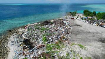 Toxic dump on island in Maldives. Aerial view of pollution problem by rubbish video
