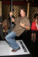 Kevin Sorbo demonstrating his moves on the Platinum Stages stripper pole GBK MTV Movie Awards Gifting Suites  Crimson  Opera Los Angeles,  CA May 30, 2008 photo