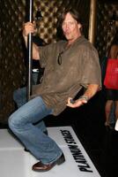 Kevin Sorbo demonstrating his moves on the Platinum Stages stripper pole GBK MTV Movie Awards Gifting Suites  Crimson  Opera Los Angeles,  CA May 30, 2008 photo