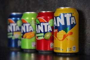 KYIV, UKRAINE - 4 MAY, 2023 Fanta soft drink brand tin cans with various flavours photo