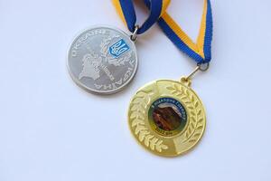 KYIV, UKRAINE - MAY 4, 2022 Medal for the person who conquered Mount Hoverla photo