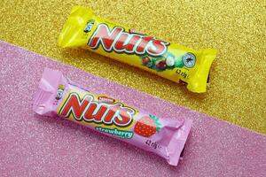 KYIV, UKRAINE - MAY 4, 2022 Nuts original chocolate bar manufactured by Nestle company photo