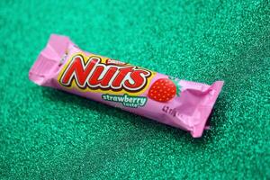 KYIV, UKRAINE - MAY 4, 2022 Nuts original chocolate bar manufactured by Nestle company photo