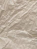 Crumpled paper. Crumpled light parchment. Vintage crumpled paper background photo