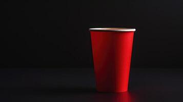 AI generated Red, vacant disposable paper cup for fast food, presented in a side view, set on a black backdrop, featuring, Ai Generated. photo