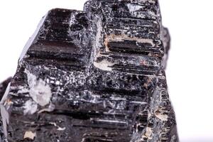 macro mineral stone sherle, schorl, black tourmaline on white background photo