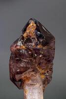 macro mineral stone  amethyst with smoky quartz on a black background photo