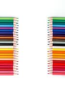 Multi-colored pencils in a row photo