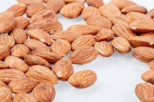 macro almond nuts on a white background photo