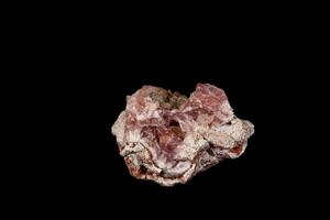 Macro mineral stone Pink Amethyst on a black background photo