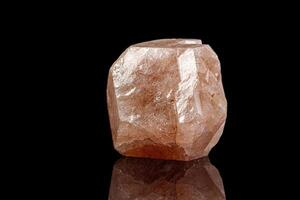 macro mineral garnet stone on a black background photo