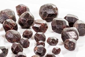 macro mineral stone  Garnet, on a white background photo