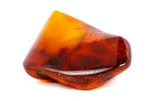 Macro Amber mineral stone on white background photo