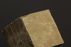 macro mineral pyrite stone on a black background photo