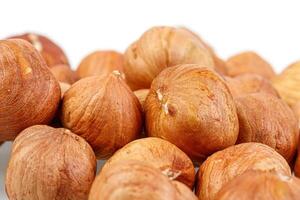 macro hazelnuts nuts on a white background photo