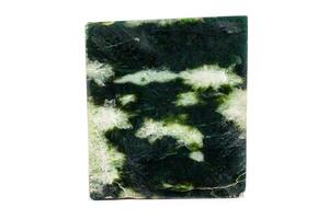 macro Roca jade mineral en blanco antecedentes foto