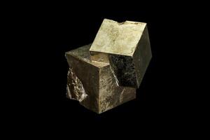 Macro mineral stone Pyrite on a black background photo