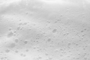 Abstract white soap foam bubbles texture background photo