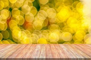 Empty wood table top with blur Christmas tree with bokeh light background photo