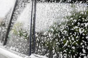 car cleaning and washing with foam soap photo