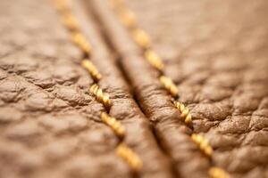 luxury brown leather bag texture background with stitching photo